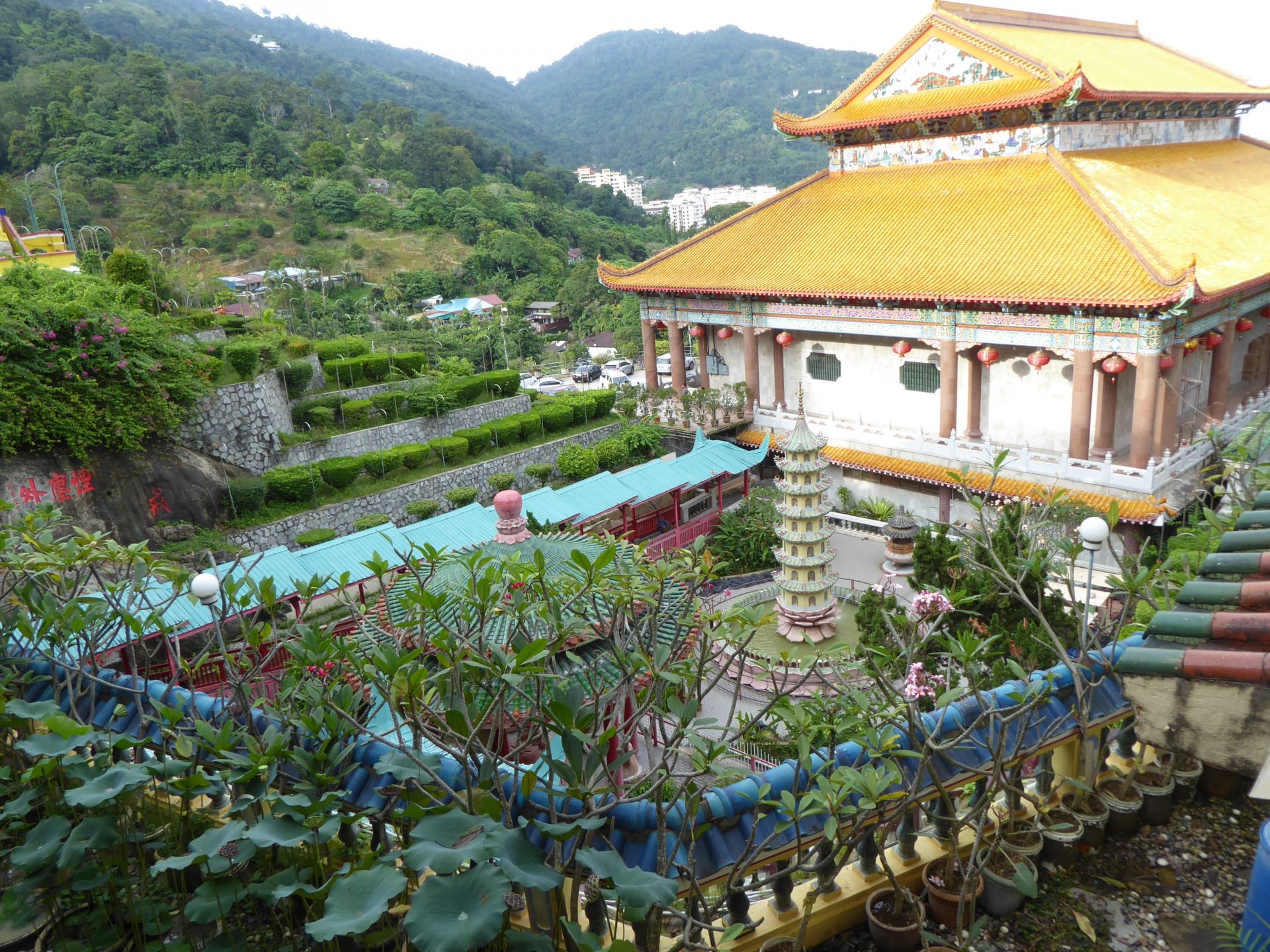 Kek Lok Si - A large Chinese style temple on Penang, with lush green hills behind it.